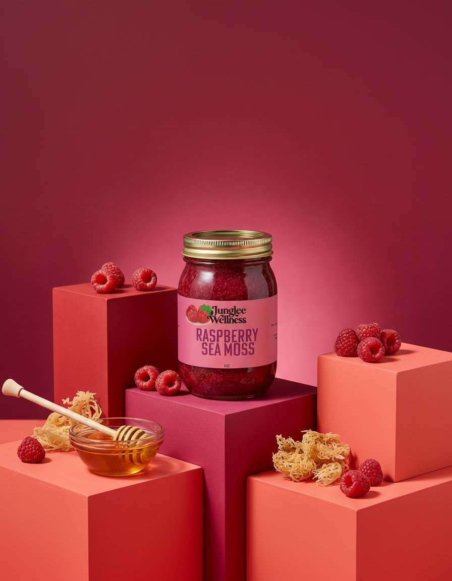 Jar of Raspberry Sea Moss on a pink platform with raspberries and honeycomb.